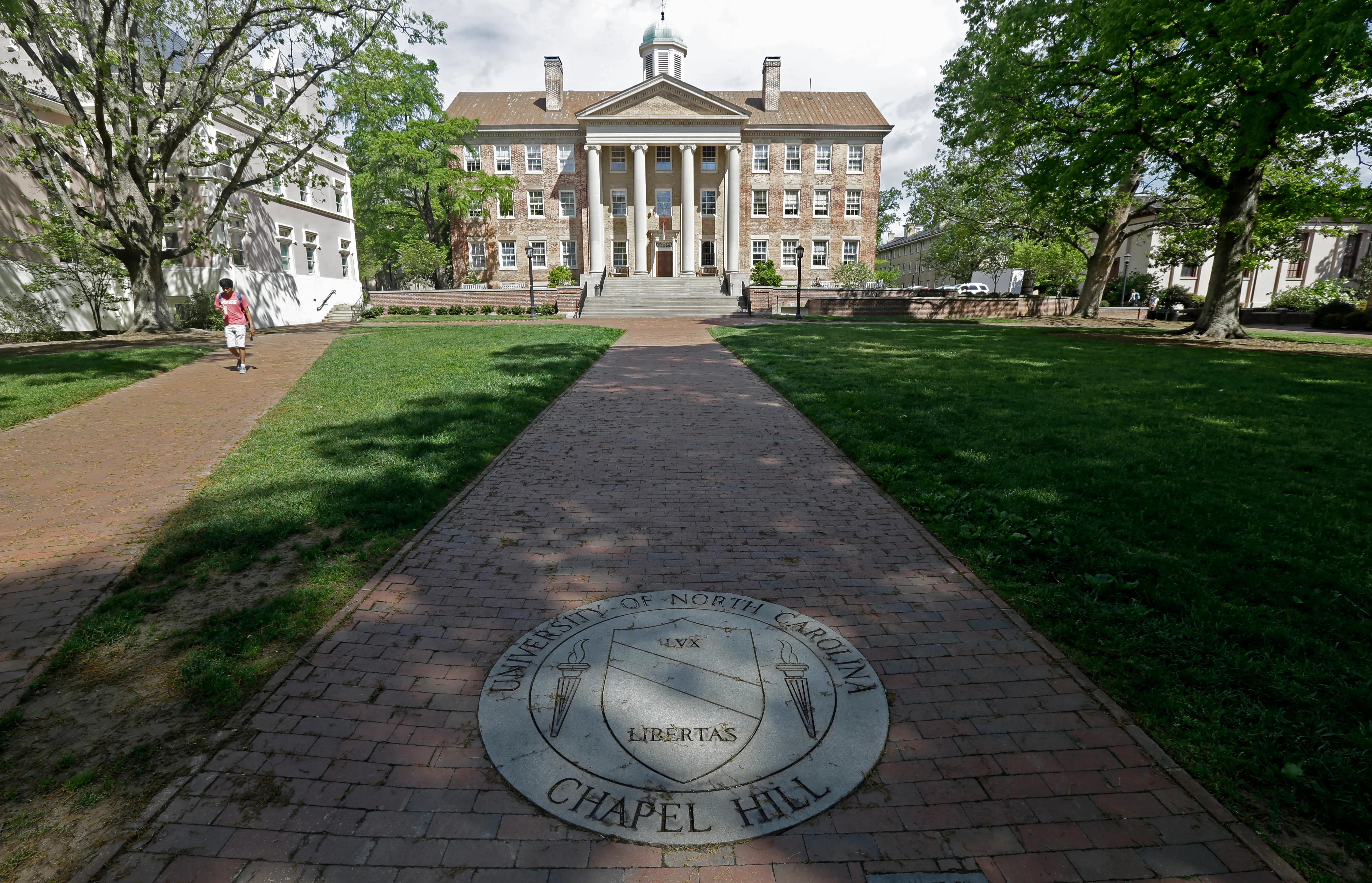 A sidewalk leads to the South Building on campus at the University of North Carolina at Chapel Hill, N.C., April 20, 2015.