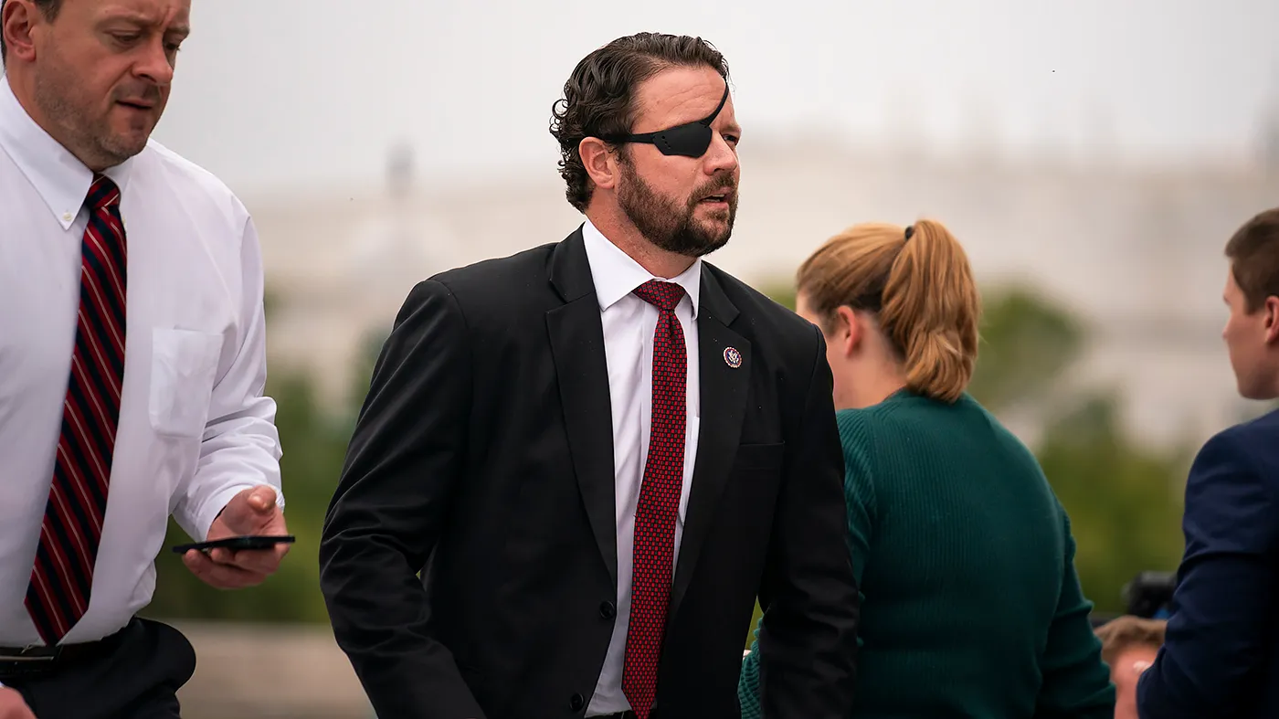 Rep. Dan Crenshaw (R-Texas) arrives at the House Chamber for the final vote series of the week on Sept. 25, 2024.