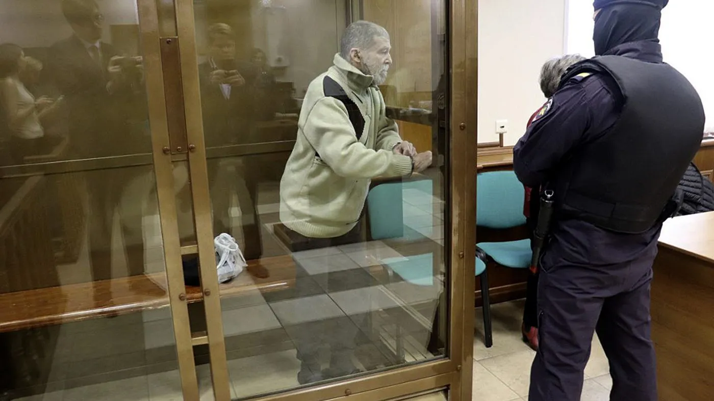 In this photo released by the Moscow City Court Press Service, Stephen Hubbard, a U.S. citizen accused of fighting as a mercenary in Ukraine against Russia, stands in a glass cage during a court session in the Moscow City court in Moscow, Russia, Oct. 7, 2024.