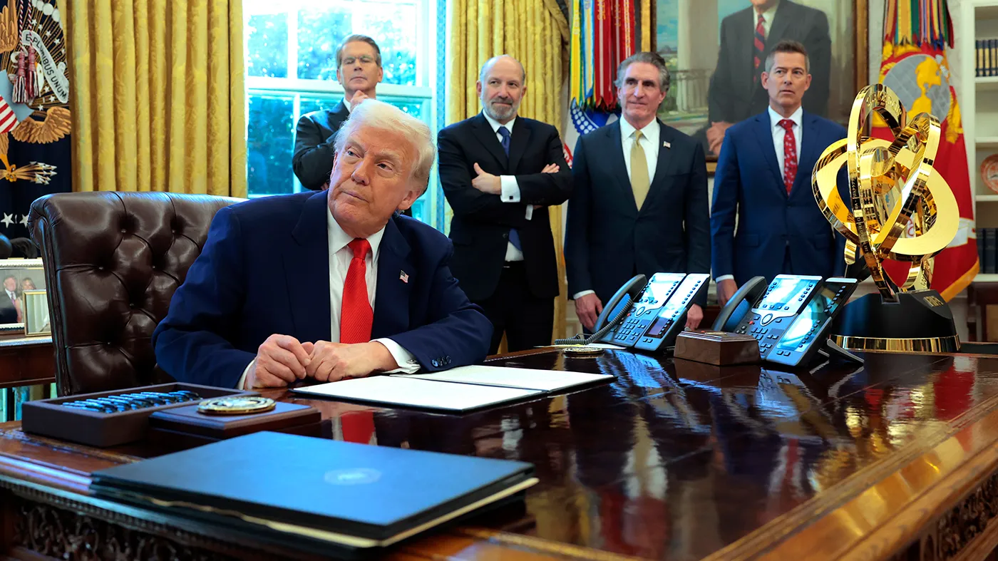 President Trump prepares to sign executive orders as Treasury Secretary Scott Bessent, Secretary of Commerce Howard Lutnick, Interior Secretary Doug Burgum and Transportation Secretary Sean Duffy look on in the Oval Office of the White House on April 9, 2025, in Washington.