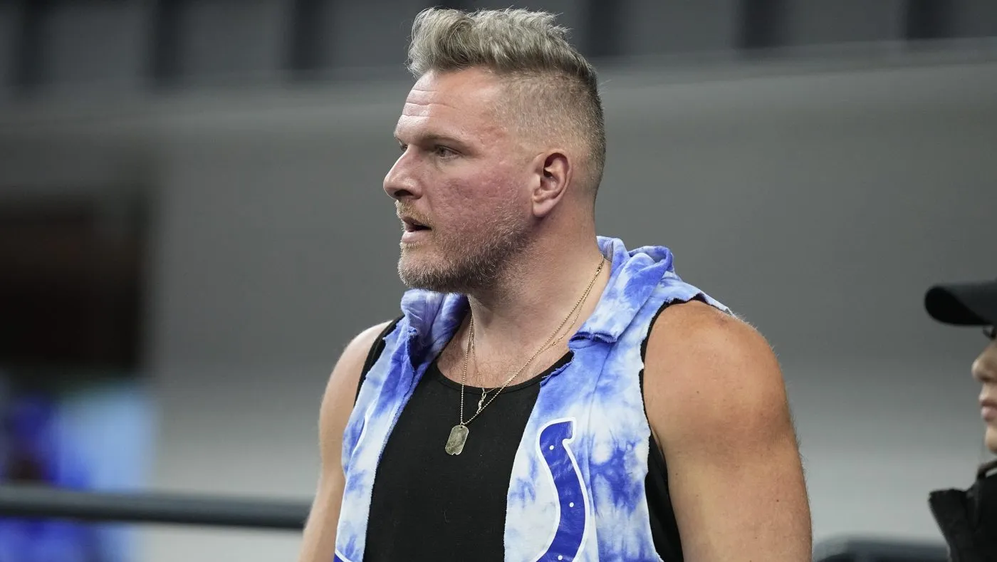 Sports analyst Pat McAfee watches an NFL football game between the Indianapolis Colts and the Houston Texans, Saturday, Jan. 6, 2024, in Indianapolis. (AP Photo/Darron Cummings)