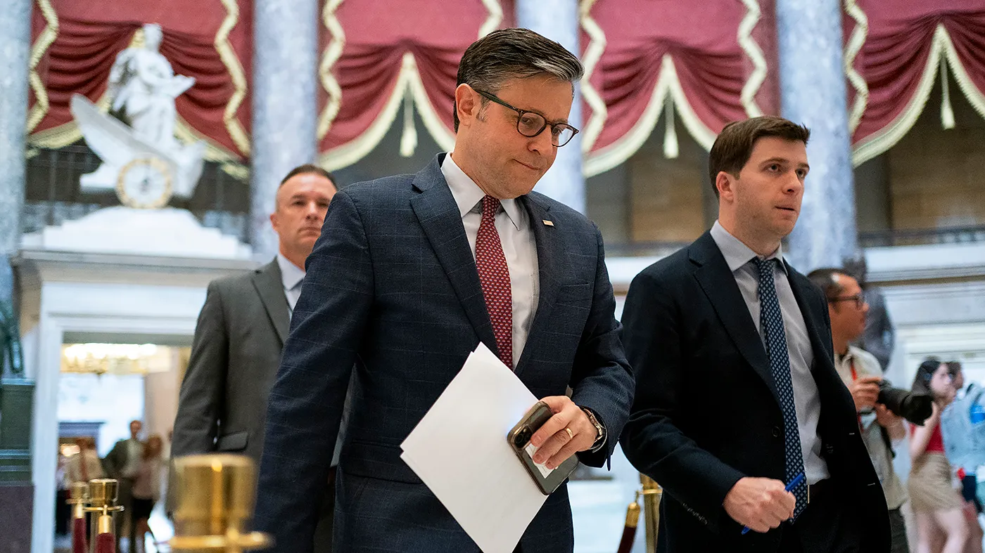 Speaker Mike Johnson (R-La.) heads to the House Chamber to open the floor on July 21, 2025.