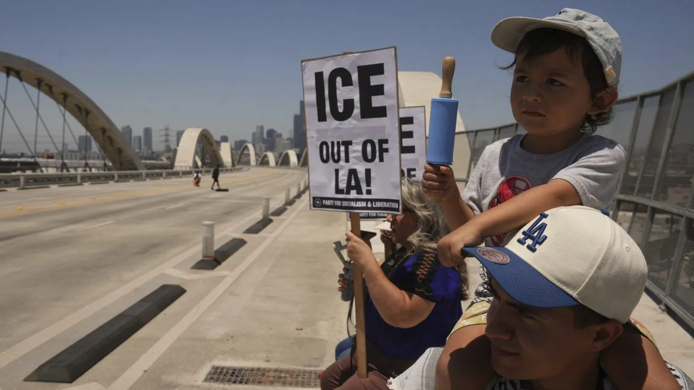 Demonstrators temporarily close the Sixth Street bridge after a rally at Hollenbeck Park calling for an end to the immigration raids by ICE in Los Angeles on July 1, 2025.