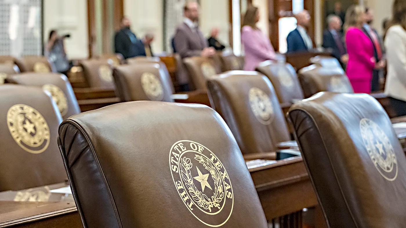 Empty chairs belonging to House Democrats remain empty during session convocation in the State Capitol, Tuesday, Aug. 5, 2025, in Austin, Texas. (AP Photo/Rodolfo Gonzalez)