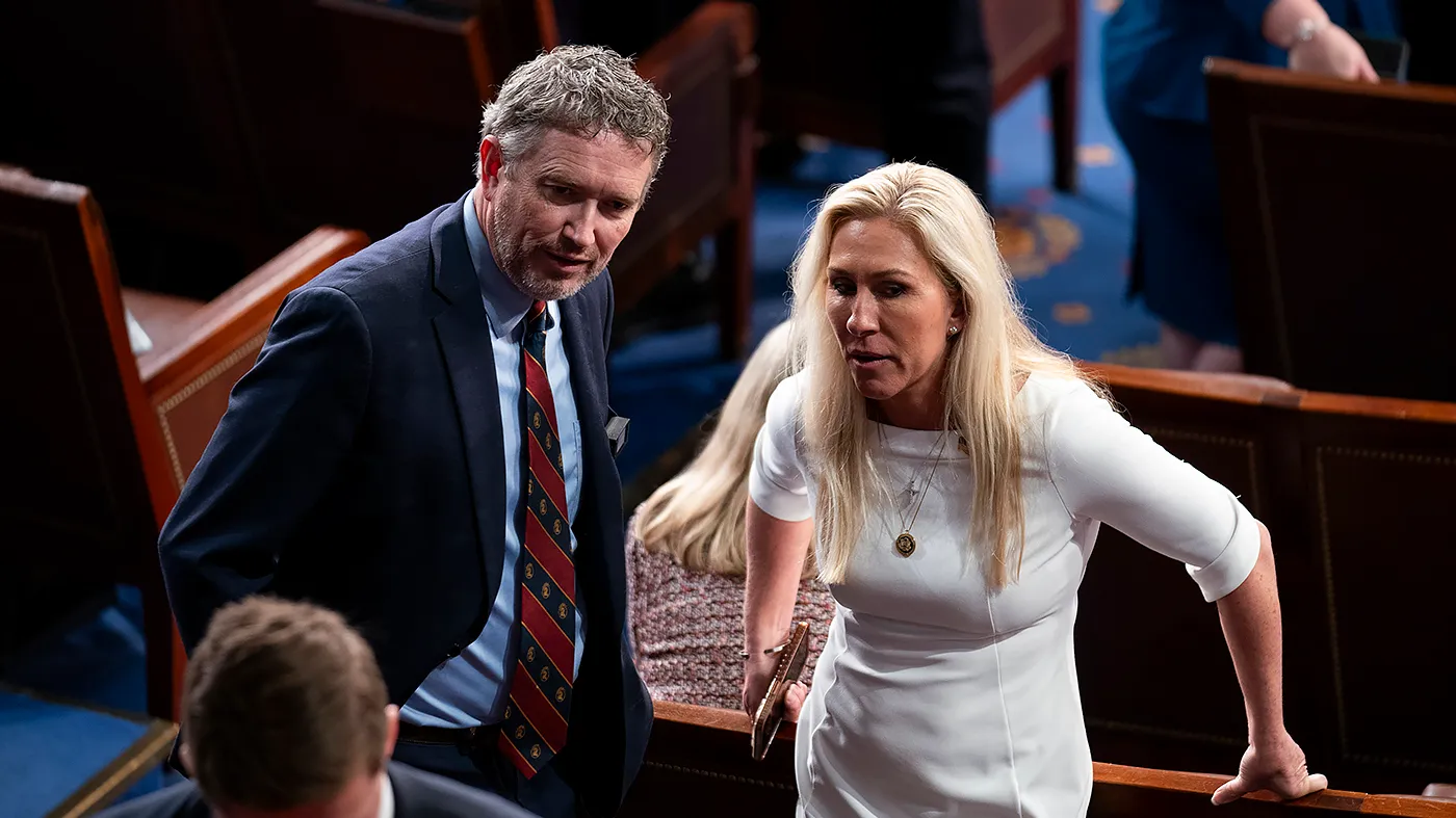 Rep.-elect Thomas Massie (R-Ky.) speaks with Rep.-elect Marjorie Taylor Greene (R-Ga.) following the first ballot for Speaker on the first day of the 119th session of Congress the Capitol in Washington, D.C., on Jan. 3, 2025.