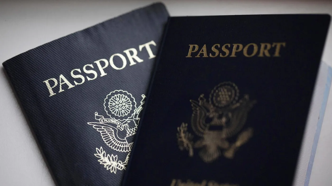 FILE – U.S. passports are arranged for a photograph in Tigard, Ore., on Dec. 11, 2021.