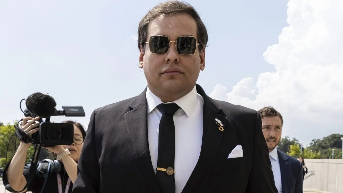 FILE – Former U.S. Rep. George Santos arrives at court in Central Islip, N.Y., Aug. 19, 2024. (AP Photo/Stefan Jeremiah, File)