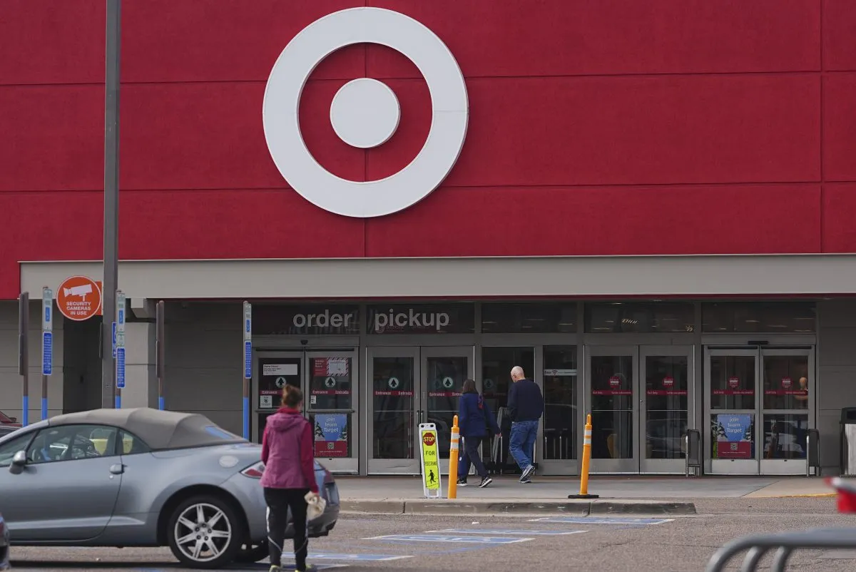 Shoppers head into a Target store Thursday, Nov. 21, 2024, in Highlands Ranch, Colo. (AP Photo/David Zalubowski)