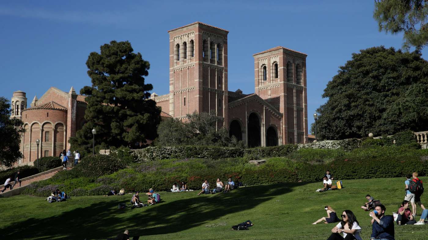 Students sit on the lawn near Royce Hall at the University of California, Los Angeles, in the Westwood section of Los Angeles on April 25, 2019.