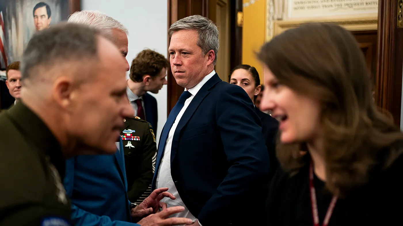 Army Secretary Dan Driscoll speaks to Rep. Steve Womack (R-Ark.) before a House Appropriations subcommittee hearing to discuss the fiscal 2027 budget request for the Army on April 16, 2026.