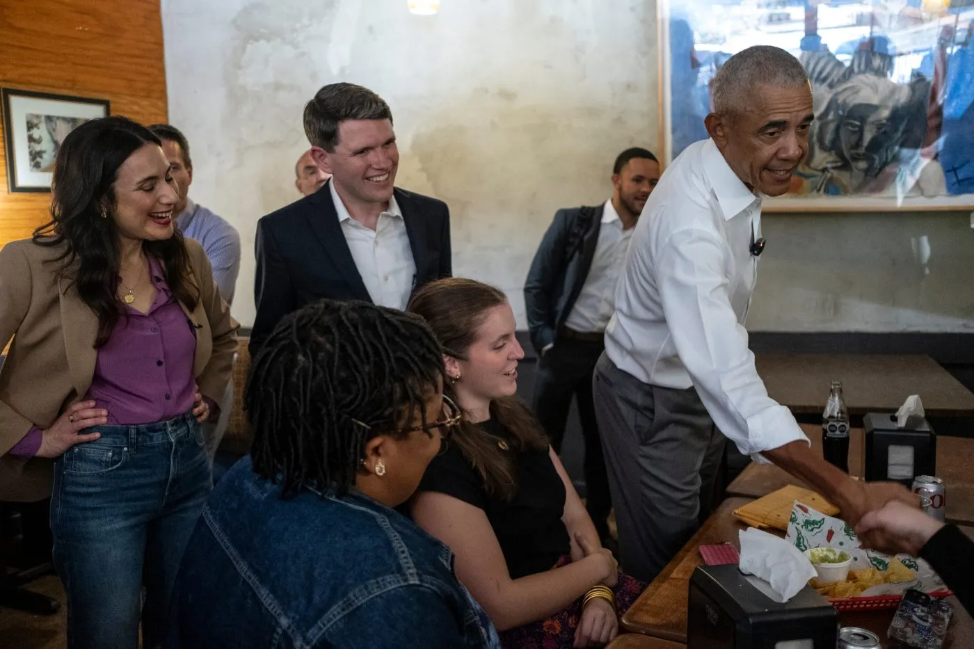 Texas Democratic gubernatorial candidate Gina Hinojosa, Texas Democratic Senate candidate and Texas state Rep. James Talarico, and former President Obama visit the Taco Joint on May 12, 2026, in Austin, Texas.