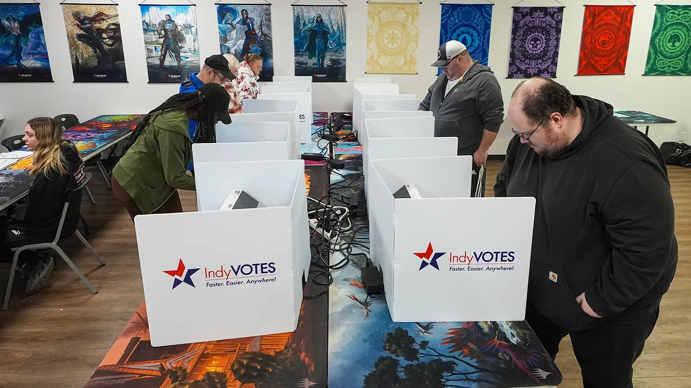Voters cast their ballots at a voting site at the Game Preserve store on Election Day in Indianapolis, Nov. 5, 2024.