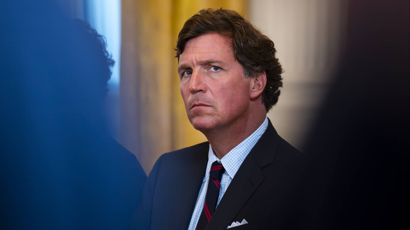 Conservative commentator Tucker Carlson attends a meeting with oil executives in the East Room of the White House on Jan. 9, 2026, in Washington.