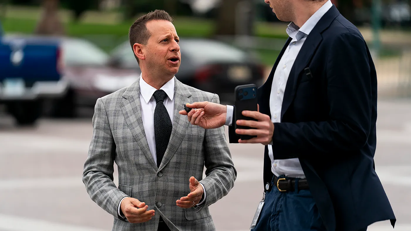 Rep. Jared Moskowitz (D-Fla.) speaks to a reporter as he arrives to the Capitol on Thursday, May 21, 2026, for a series of votes including the Smithsonian American Women’s History Museum and a Democratic-led war powers bill on Iran.