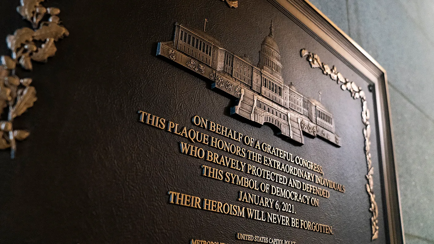 A plaque honoring police officers who served during the Jan. 6, 2021, attack on the Capitol is seen at the West Front door on March 17, 2026.
