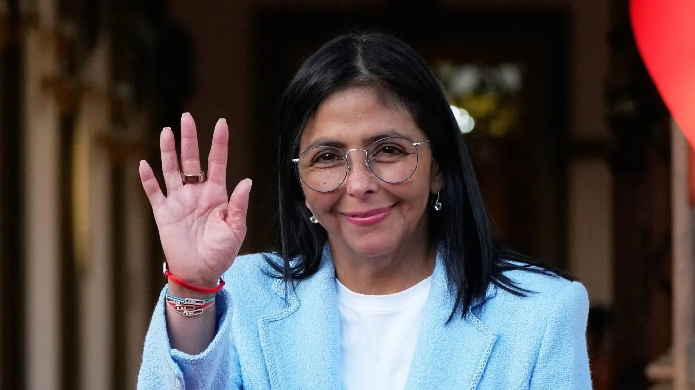 FILE – Venezuela’s acting President Delcy Rodriguez waves after bidding farewell to U.S. Energy Secretary Chris Wright following their meeting at Miraflores Palace in Caracas, Venezuela, Feb. 11, 2026. (AP Photo/Ariana Cubillos, File)