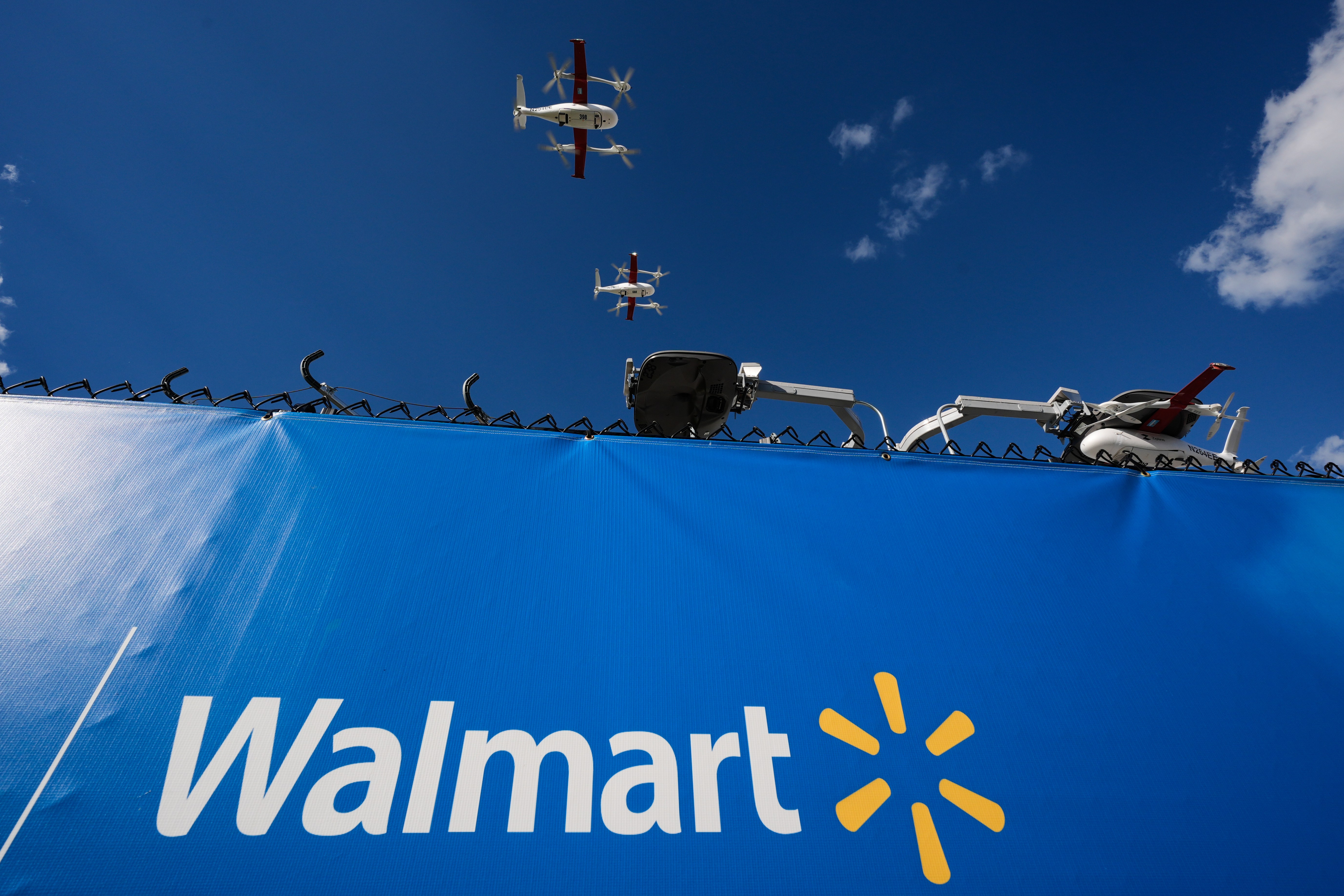 Drones operated by Zipline leave base to make deliveries from a Walmart store in Pea Ridge, Ark., Friday, Sept. 26, 2025. (AP Photo/Charlie Riedel)