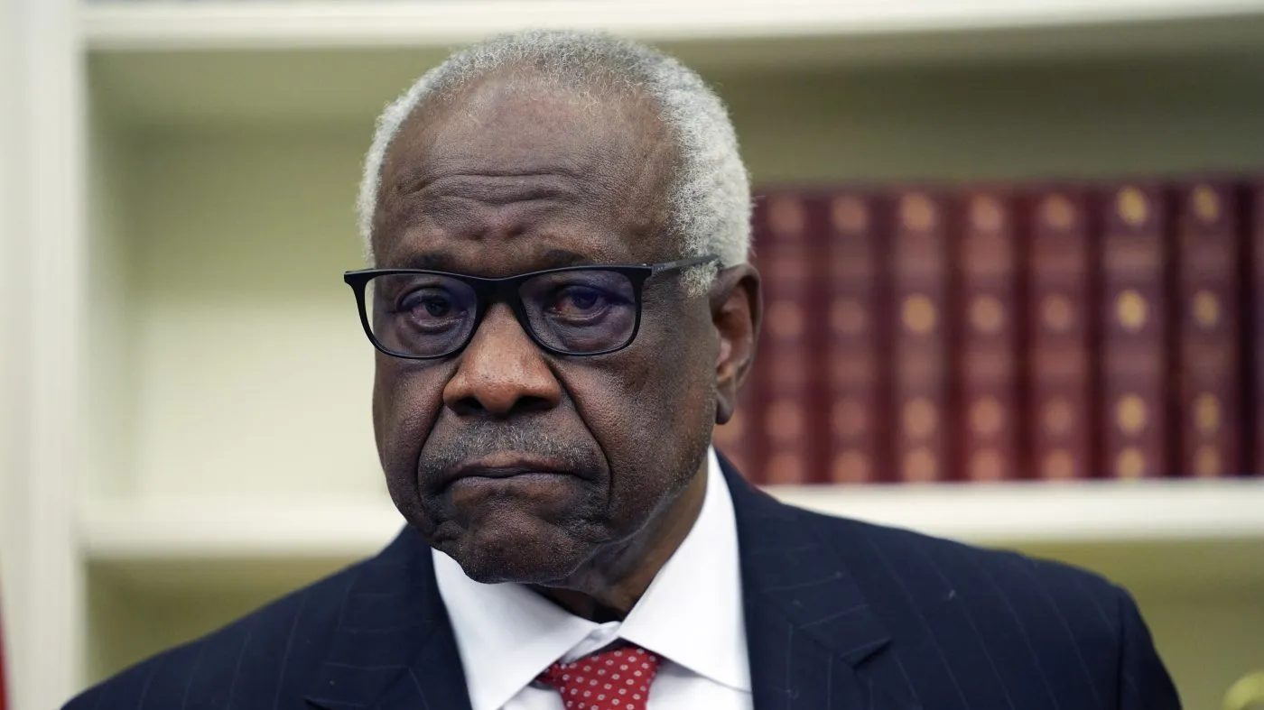 Supreme Court Justice Clarence Thomas listens to President Trump speak before a swearing-in ceremony on Feb. 5, 2025, in the Oval Office of the White House in Washington.