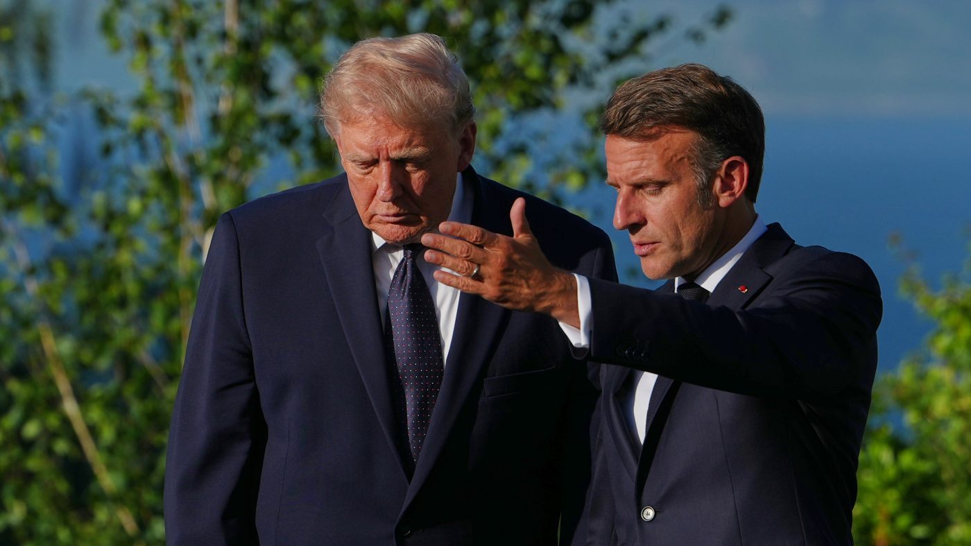 U.S. President Donald Trump talks with France’s President Emmanuel Macron at the G7 summit, Monday, June 15, 2026, in Evian-les-Bains, France. (AP Photo/Julia Demaree Nikhinson)