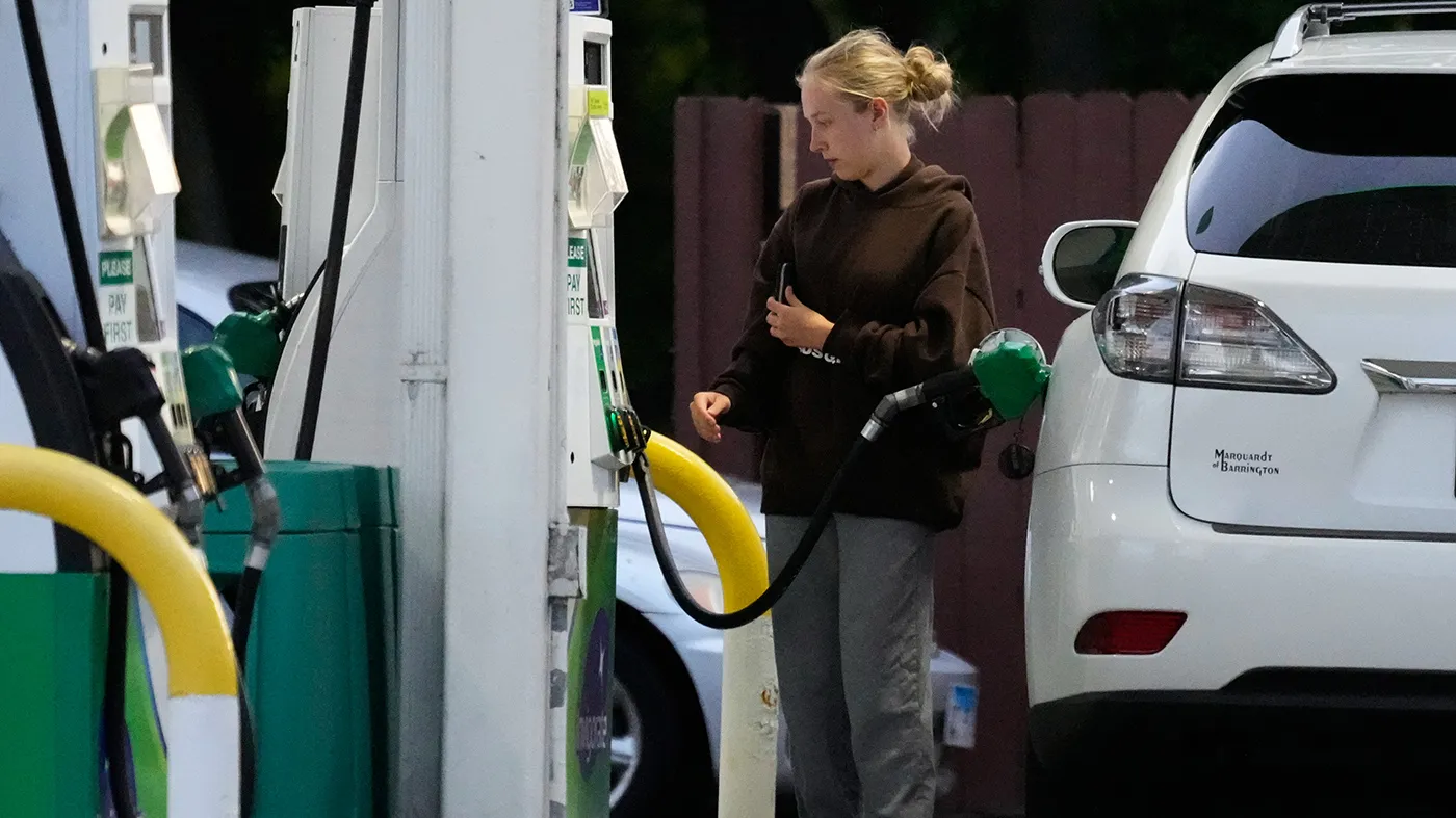 Customer checks gas price before she fills up her vehicle’s tank at a gas station in Lincolnshire, Ill., Monday, June 8, 2026.