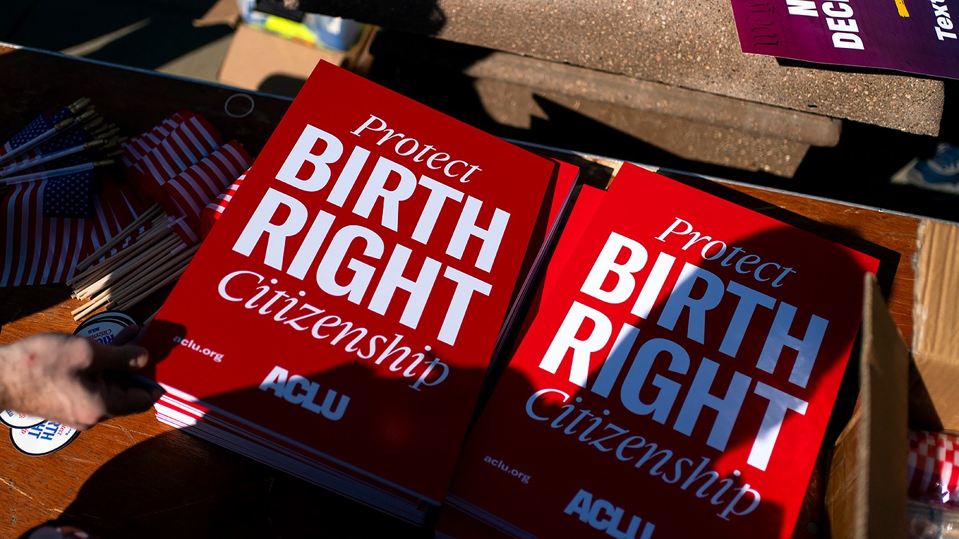 Signs are seen at the Supreme Court in Washington, D.C., as the court hears oral arguments in Trump vs. Barbara regarding birthright citizenship on April 1, 2026.