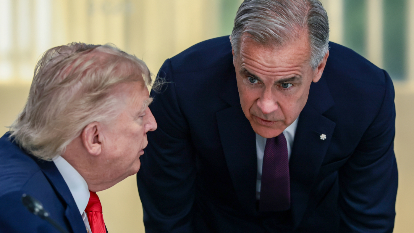 U.S. President Donald Trump, left, speaks with Canadian Prime Minister Mark Carney, right, at a working lunch with leaders of G7 and the Middle East, in Evian-les-Bains, France, Tuesday, June 16, 2026. (Evelyn Hockstein/Pool Photo via AP)