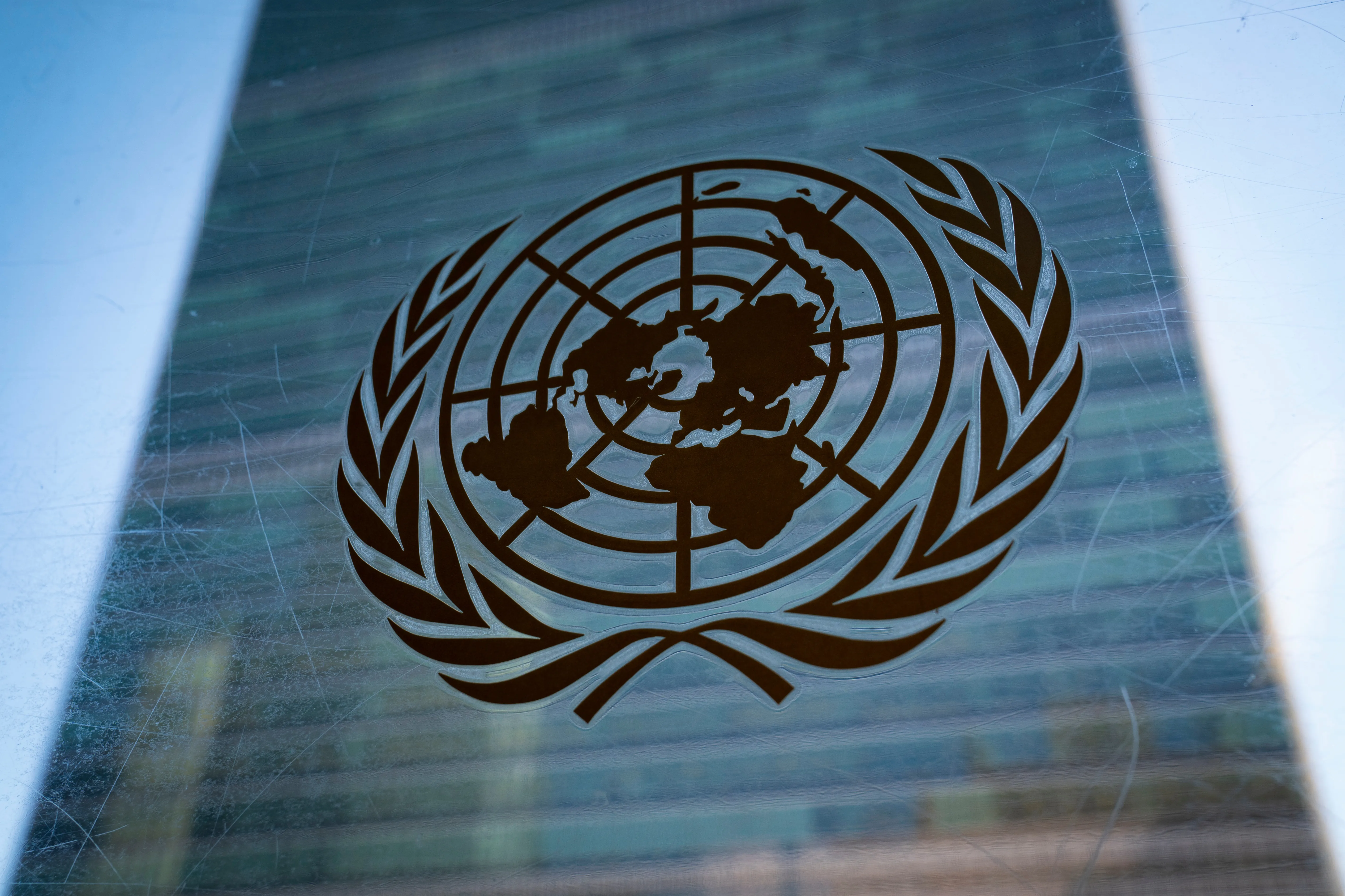 FILE – The symbol of the United Nations is displayed outside the Secretariat Building, Feb. 28, 2022, at United Nations Headquarters. (AP Photo/John Minchillo, File)