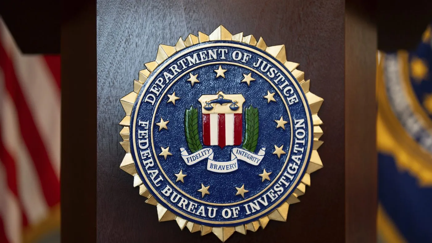 An FBI seal is displayed on a podium before a news conference at the field office in Portland, Ore., on Jan. 16, 2025.