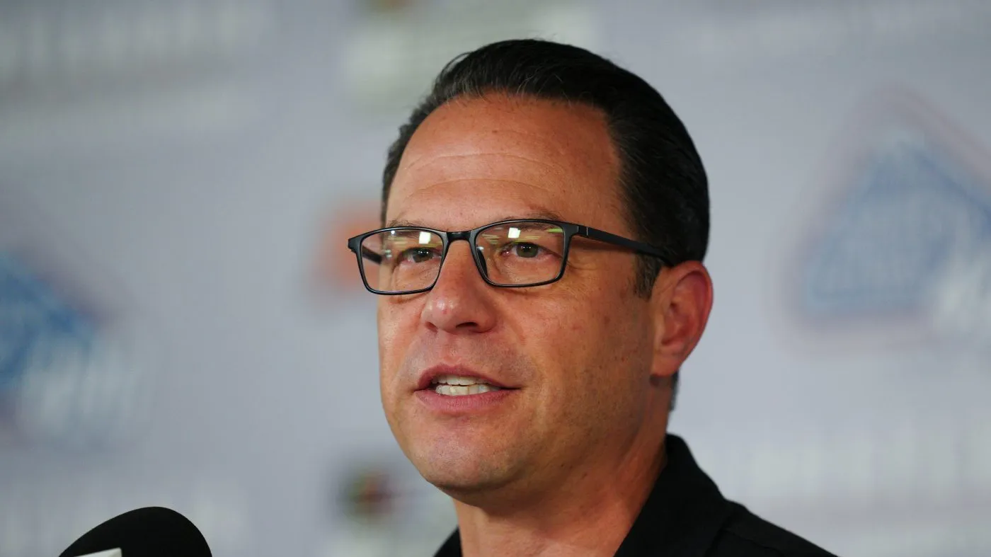 Pennsylvania Gov. Josh Shapiro talks to the media prior to a NASCAR Cup Series auto race at Pocono Raceway, Sunday, June 14, 2026, in Long Pond, Pa. (AP Photo/Derik Hamilton)