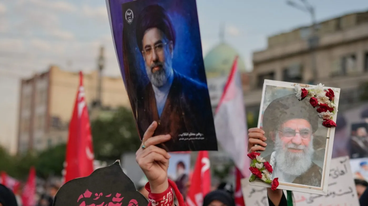 Mourners chant while holding portraits of Iran’s new Supreme Leader Mojtaba Khamenei and the slain Iranian Supreme Leader Ayatollah Ali Khamenei during Khamenei’s funeral procession in Tehran, Iran, July 6, 2026. (AP Photo/Altaf Qadri)