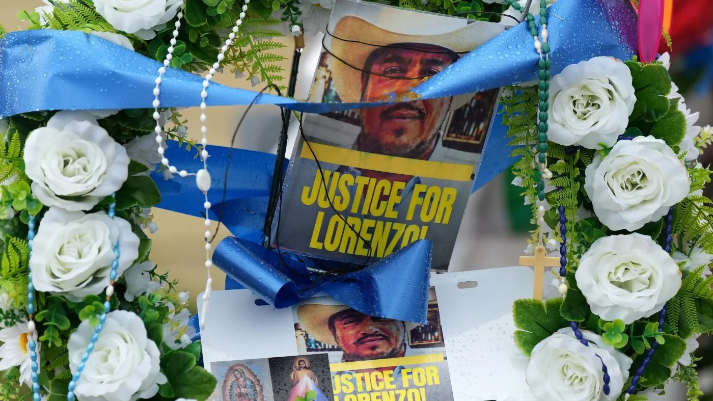 Messages and flowers are left at a growing memorial at the site where Lorenzo Salgado Araujo was fatally shot by ICE officers is seen on July 13, 2026, in Houston.