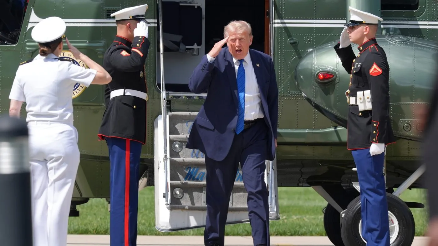 President Donald Trump salutes as he arrives on Marine One to Camp David, the presidential retreat, near Thurmont, Md., Friday, July 31, 2026.