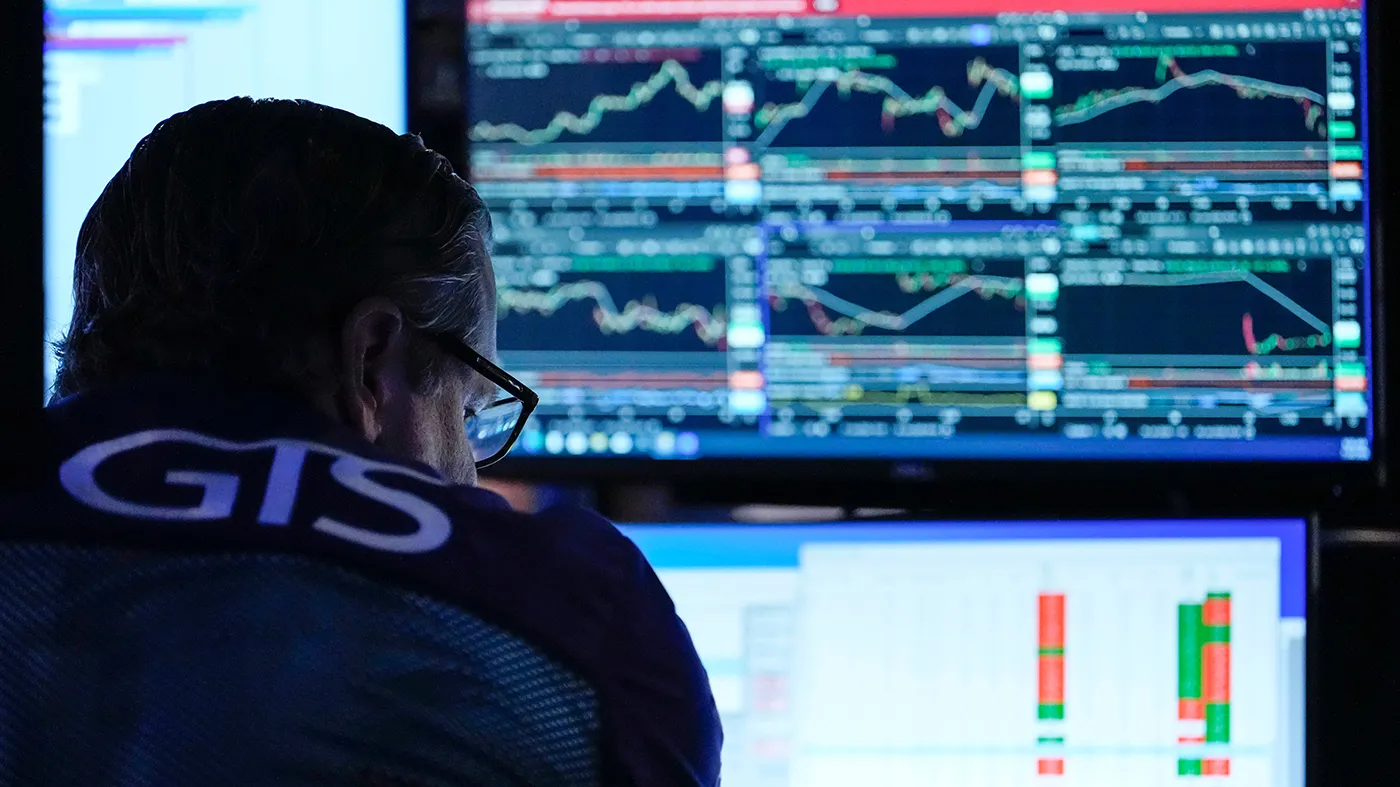 A trader works on the floor of the New York Stock Exchange, July 30, 2026, in New York.