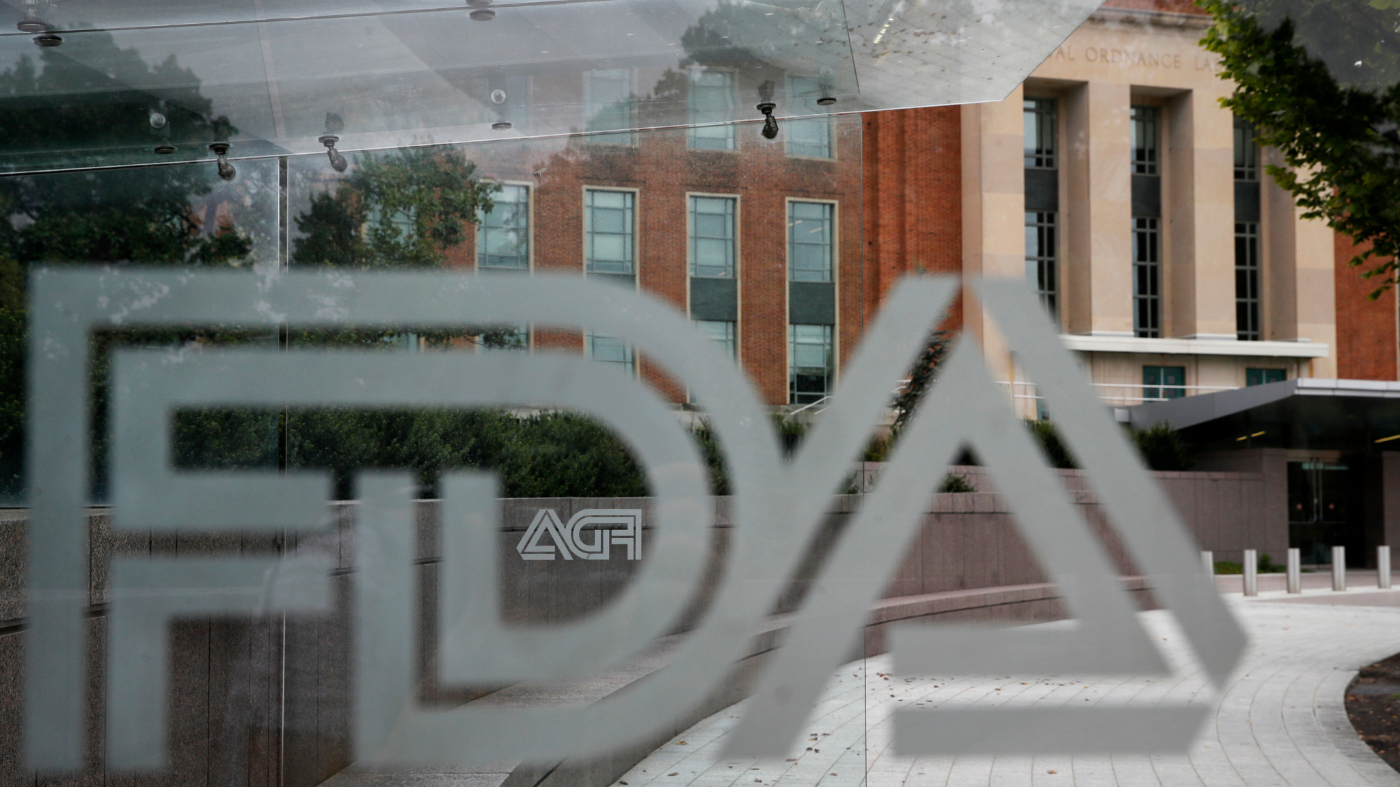 FILE – The U.S. Food and Drug Administration building is seen behind FDA logos at a bus stop on the agency’s campus in Silver Spring, Md., Aug. 2, 2018. (AP Photo/Jacquelyn Martin, File)