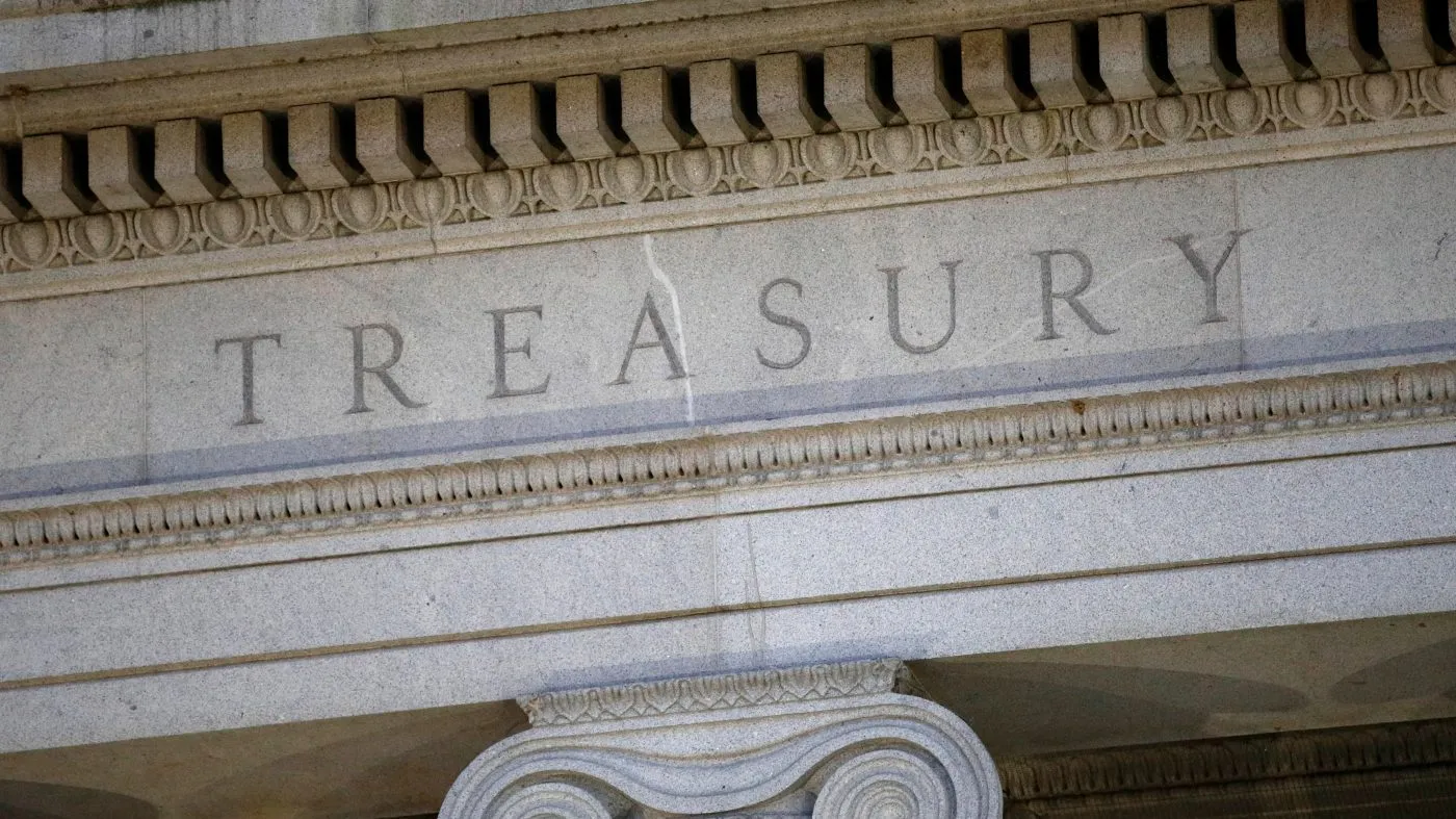 FILE – The Treasury Department building is pictured at dusk in Washington, June 6, 2019. (AP Photo/Patrick Semansky, File)