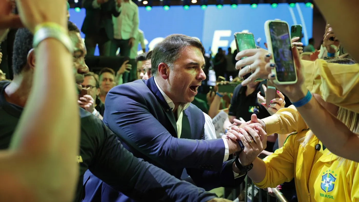 Brazilian Sen. Flavio Bolsonaro greets supporters as he arrives to the Liberal Party convention where he was confirmed as the party’s presidential candidate, in Sao Paulo, Saturday, July 25, 2026. (AP Photo/Ettore Chiereguini)