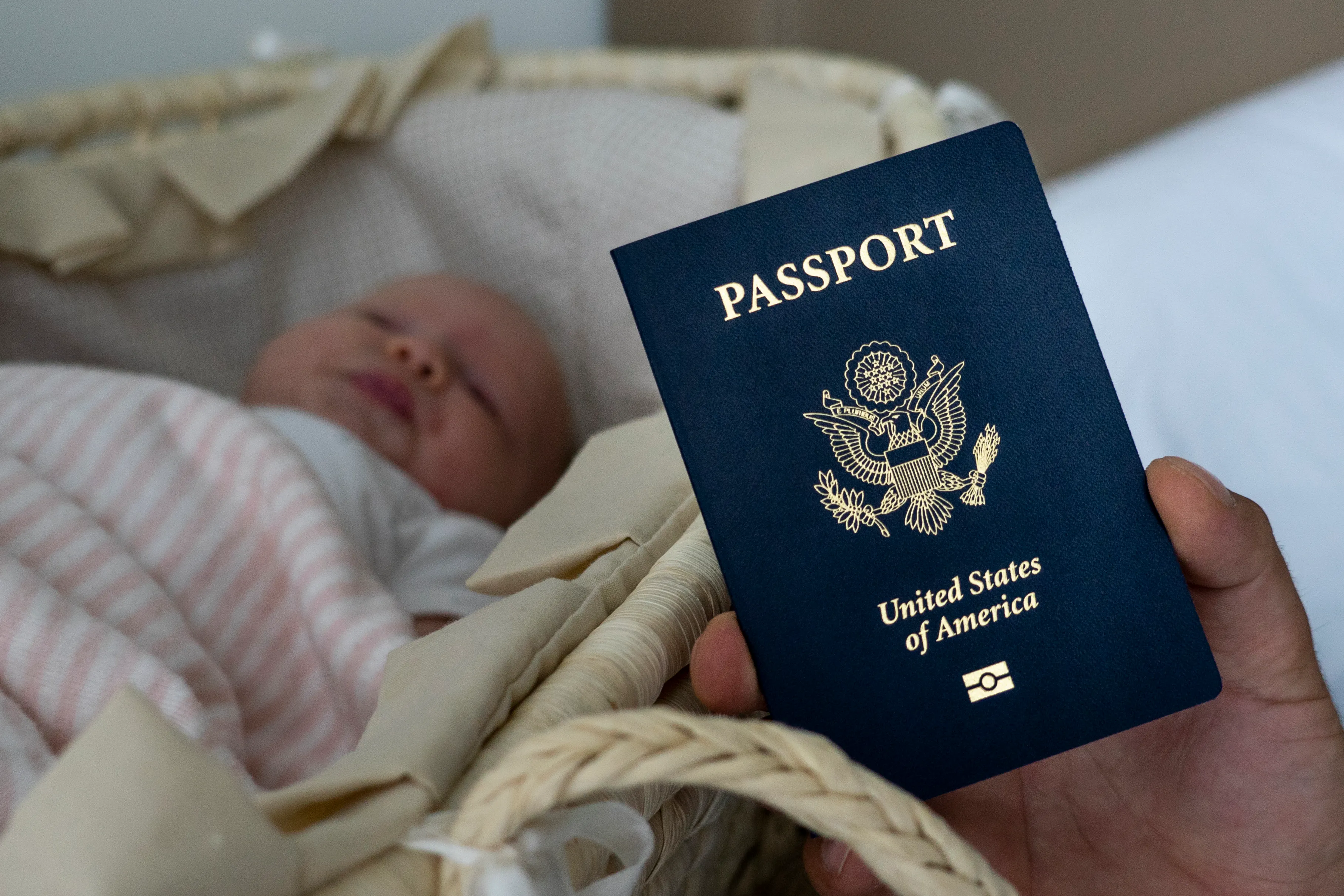 Denis Wolok, the father of 1-month-old Eva’s father, shows the child’s U.S. passport during an interview with The Associated Press in Hollywood, Fla., Jan. 24, 2019. Every year, hundreds of pregnant Russian women, like Wolok’s wife, Olga Zemlyanaya, travel to the United States to give birth so that their child can acquire all the privileges of American citizenship.