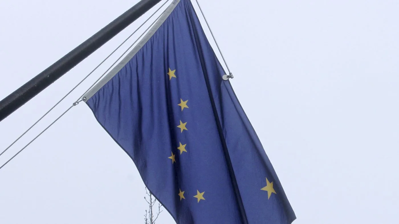 A state of Alaska flag flies outside the Atwood Building in downtown Anchorage, Alaska, on March 11, 2022.