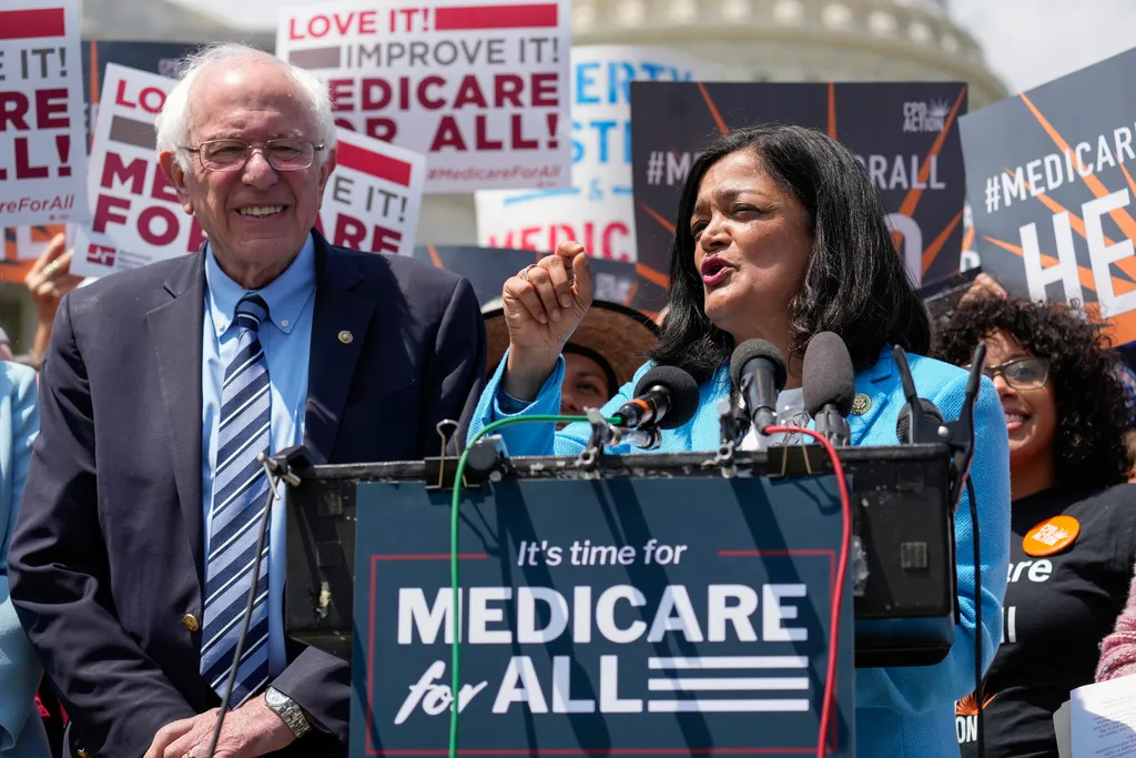 Rep. Pramila Jayapal, D-Wash., joined by Sen. Bernie Sanders, I-Vt., left, speaks during a news conference on Capitol Hill in Washington, Wednesday, May 17, 2023, about Medicare for All. (AP Photo/Carolyn Kaster)