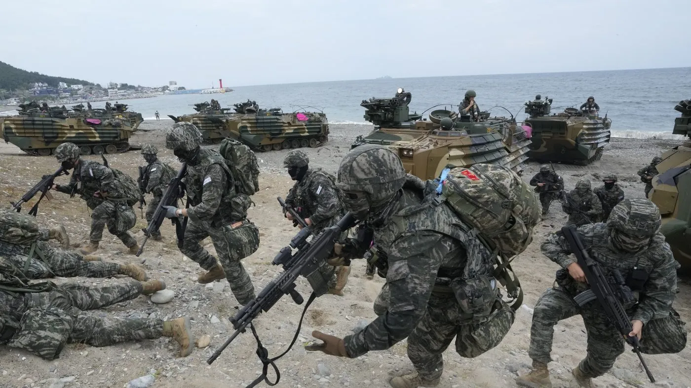 South Korean marines run out from amphibious assault vehicles after landing on the beach during the combined military amphibious landing exercise between South Korea and the U.S., called Ssangyong exercise, in Pohang, South Korea, Sept. 2, 2024.