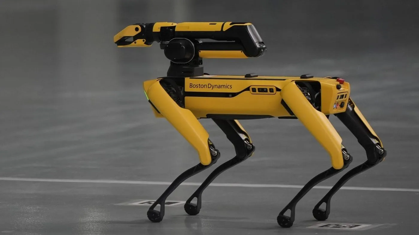 A Boston Dynamics robot moves on the floor during a media tour at the Hyundai Motor Group Metaplant America, Wednesday, March 26, 2025, in Ellabell, Ga. (AP Photo/Mike Stewart)