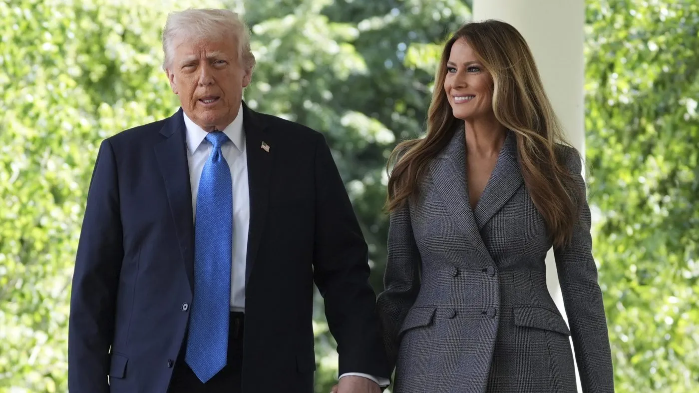 President Donald Trump, left, and first lady Melania Trump walk to speak during a bill signing event for the “Take it Down Act” in the Rose Garden of the White House, Monday, May 19, 2025, in Washington. (AP Photo/Evan Vucci)