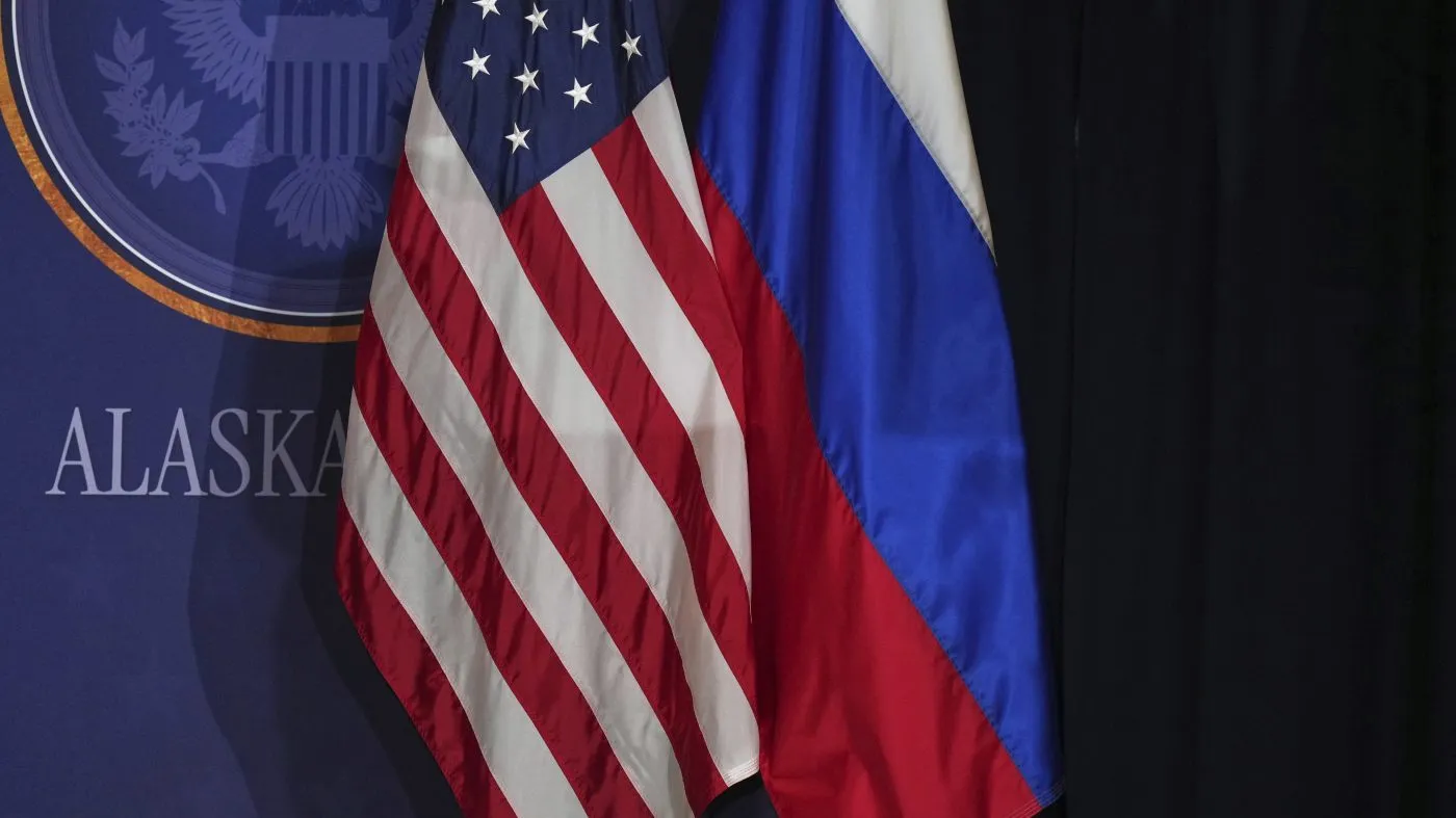 FILE – American and Russian flags are pictured on stage before President Donald Trump and Russia’s President Vladimir Putin participate in a joint press conference at Joint Base Elmendorf-Richardson, Alaska, Friday, Aug. 15, 2025. (AP Photo/Jae C. Hong)
