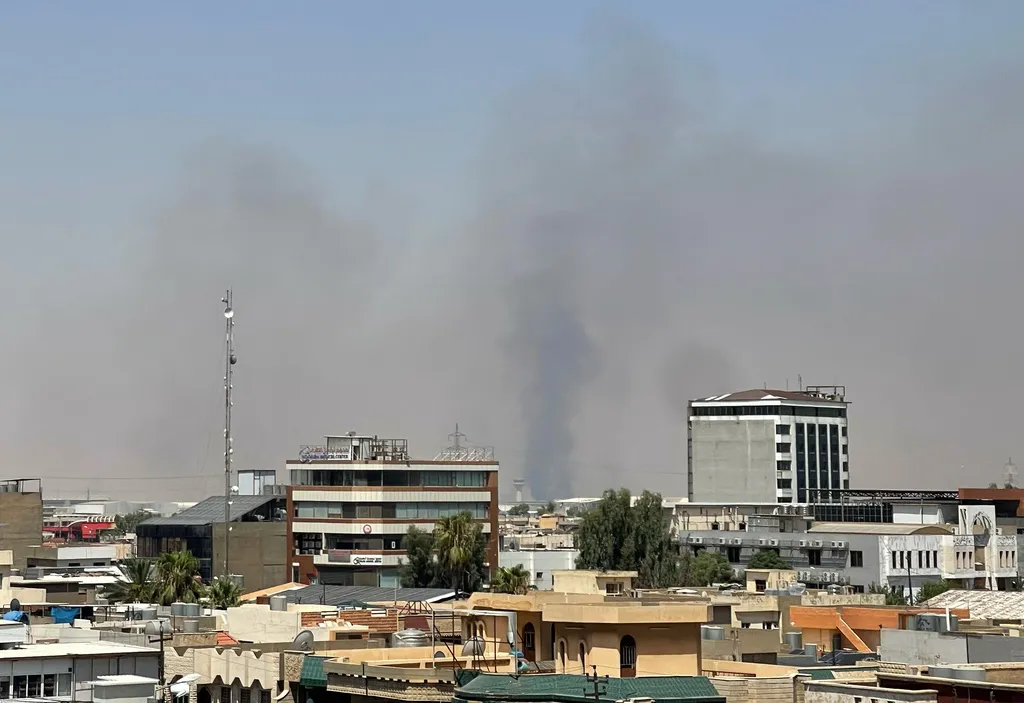 Black smoke rises following explosions near a military base hosting U.S. forces in the northern Iraqi city of Irbil, Friday, July 24, 2026. (AP Photo/Stella Martany)