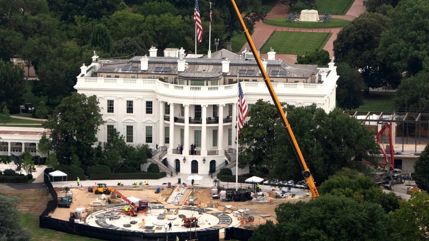 Workers build a helipad on the South Lawn of the White House, Friday, July 31, 2026, in Washington. (AP Photo/Mark Schiefelbein)