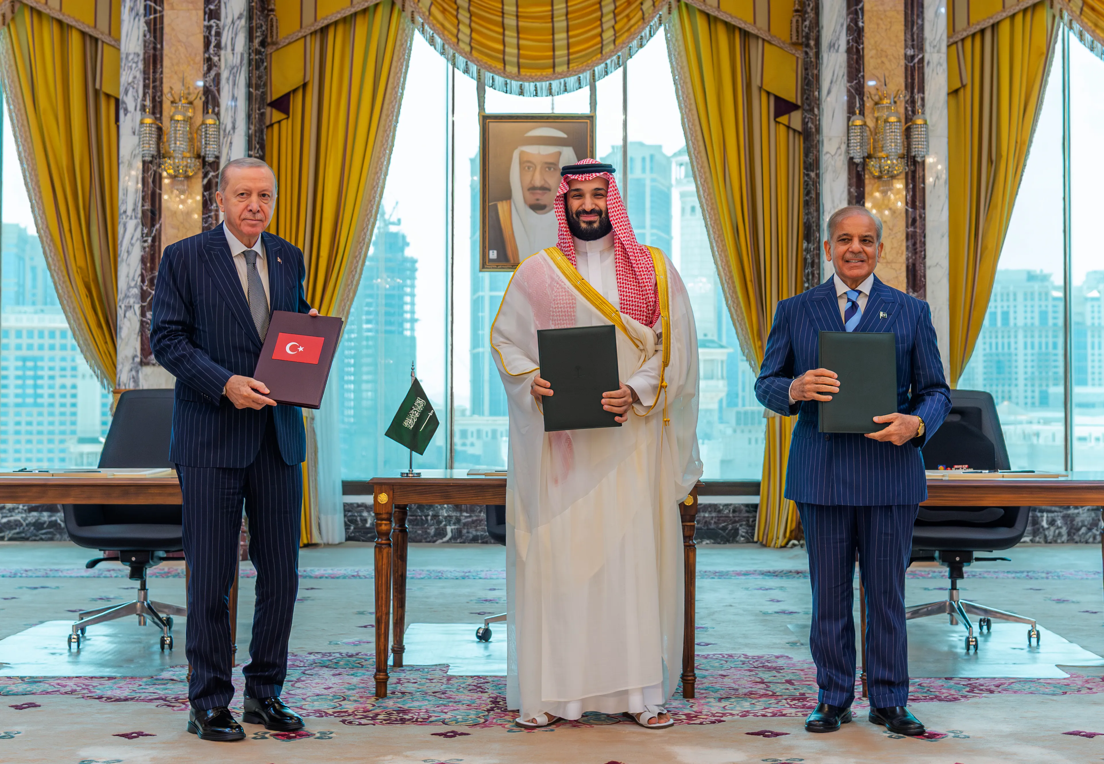 From left, Turkish President Recep Tayyip Erdogan, Saudi Crown Prince Mohammed bin Salman and Pakistani Prime Minister Shehbaz Sharif pose after signing a trilateral defense agreement in Mecca this month.