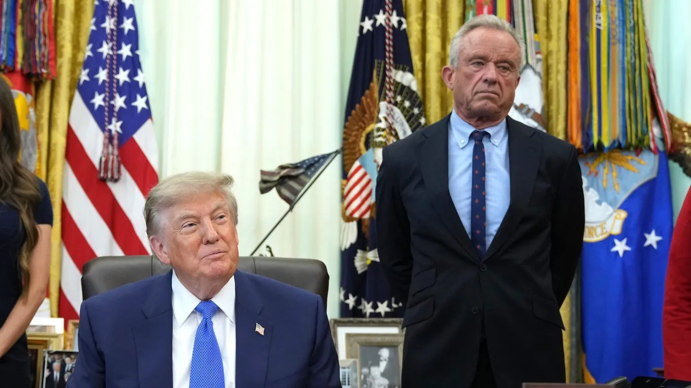 President Donald Trump, left, and Health and Human Services Secretary Robert F. Kennedy Jr. attend a meeting before Trump signs an executive order about vaccines, Monday, Aug. 10, 2026, in the Oval Office of the White House in Washington. (AP Photo/Jacquelyn Martin)