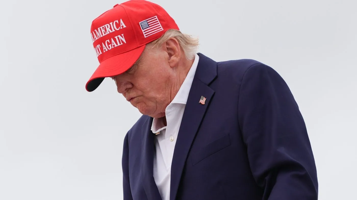 President Donald Trump disembarks Air Force One, Sunday, Aug. 16, 2026, at Joint Base Andrews, Md. (AP Photo/Julia Demaree Nikhinson)