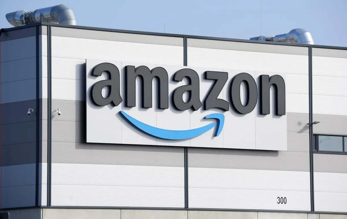 FILE – An Amazon company logo marks the facade of a building, March 18, 2022, in Schoenefeld near Berlin. (AP Photo/Michael Sohn, File)