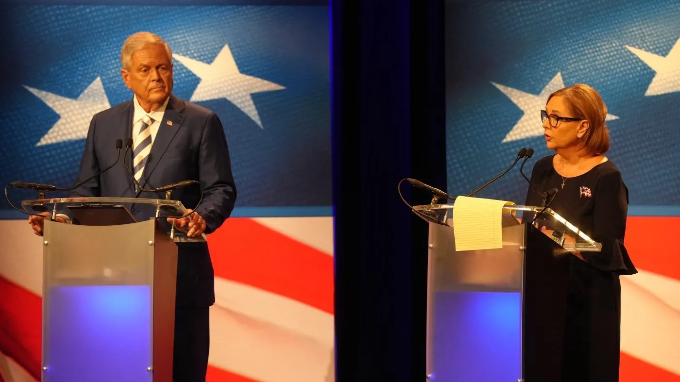 Rep. Ralph Norman (R-S.C.), left, looks on as Sen. Darline Graham (R-S.C.) speaks during a debate ahead of the special GOP Senate runoff election to replace the late Sen. Lindsey Graham (R-S.C.) in Newberry, S.C., Aug. 18, 2026.